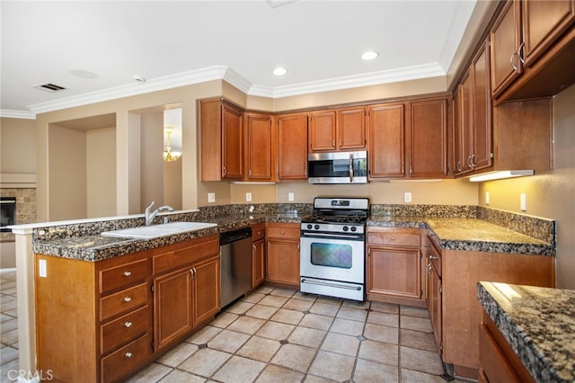 31241 Casera Ct, Menifee, CA 92584 - kitchen with appliances with stainless steel finishes, brown cabinets, crown molding, dark countertops, and a peninsula