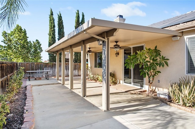 31241 Casera Ct, Menifee, CA 92584 - fenced backyard with a patio and a ceiling fan