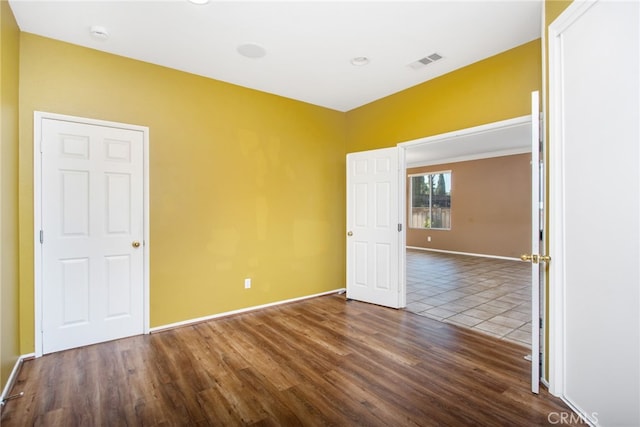 31241 Casera Ct, Menifee, CA 92584 - empty room featuring dark wood-type flooring and a smoke detector