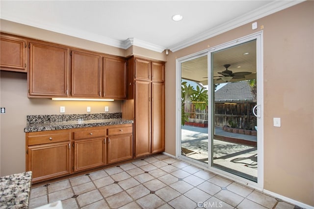 31241 Casera Ct, Menifee, CA 92584 - kitchen featuring brown cabinetry, crown molding, a ceiling fan, and recessed lighting