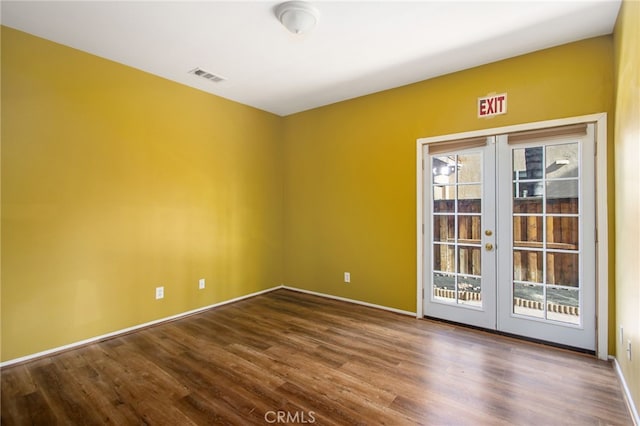 31241 Casera Ct, Menifee, CA 92584 - empty room featuring french doors and dark wood-style flooring