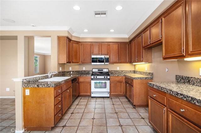 31241 Casera Ct, Menifee, CA 92584 - kitchen featuring appliances with stainless steel finishes, brown cabinetry, crown molding, recessed lighting, and light tile patterned floors