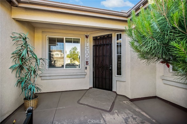 31241 Casera Ct, Menifee, CA 92584 - doorway to property featuring stucco siding