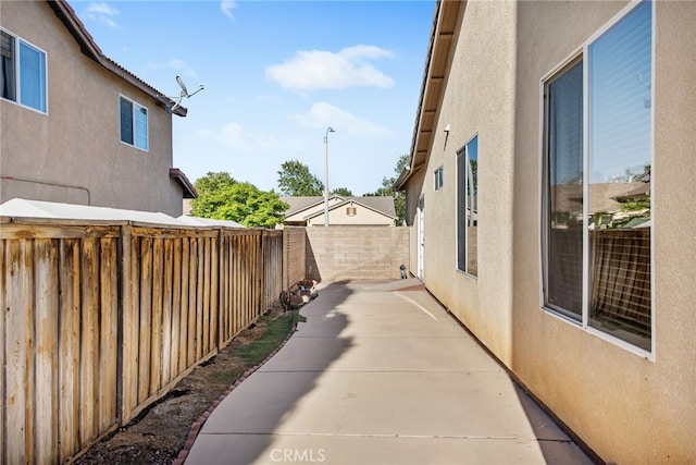 31241 Casera Ct, Menifee, CA 92584 - view of home's exterior with stucco siding, a fenced backyard, and a patio area