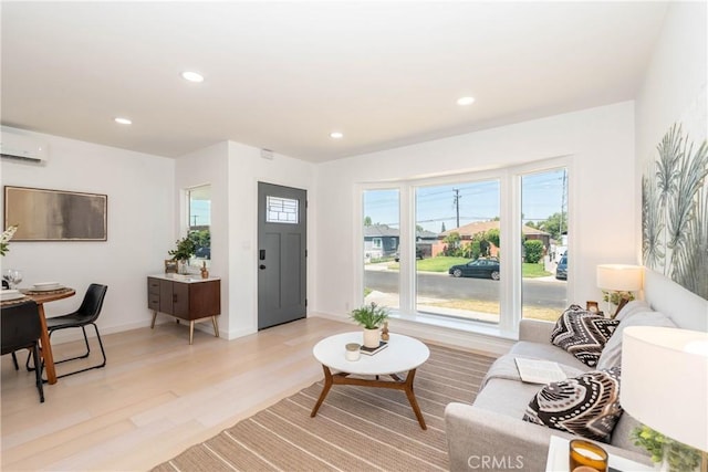 8168 Summerfield Ave, Whittier, CA 90606 - living room featuring a wall mounted air conditioner, light wood-style flooring, and recessed lighting