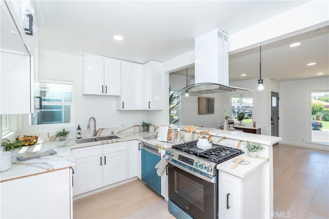 8168 Summerfield Ave, Whittier, CA 90606 - kitchen with stainless steel gas stove, island exhaust hood, dishwasher, a peninsula, and light wood-style flooring