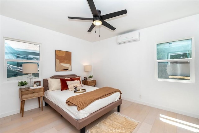 8168 Summerfield Ave, Whittier, CA 90606 - bedroom featuring a wall mounted AC, light wood-type flooring, and ceiling fan