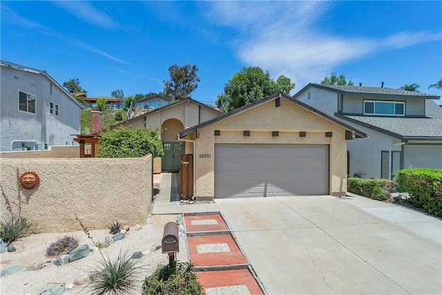 26551 Fresno Dr, Mission Viejo, CA 92691 - view of front of house featuring a garage, concrete driveway, and stucco siding