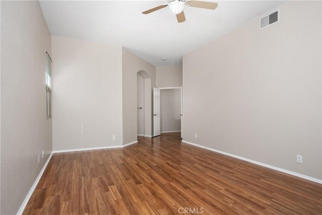 42730 Settlers Rdg, Murrieta, CA 92562 - empty room featuring a ceiling fan, arched walkways, and wood finished floors