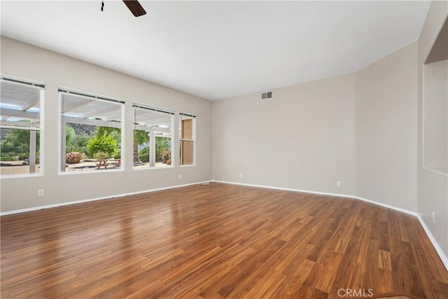 42730 Settlers Rdg, Murrieta, CA 92562 - unfurnished room with plenty of natural light, wood finished floors, and ceiling fan