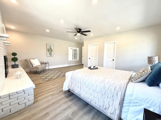 9944 Donner St, Santee, CA 92071 - bedroom featuring a fireplace, light wood-style floors, recessed lighting, and ceiling fan