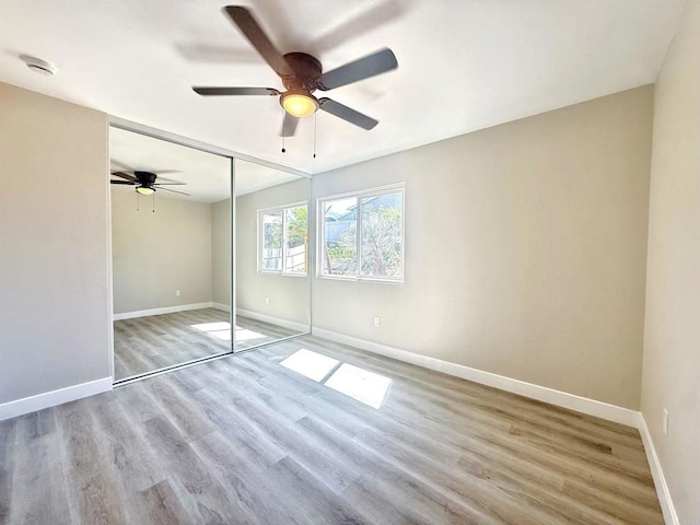 9944 Donner St, Santee, CA 92071 - unfurnished bedroom with light wood-style floors, a closet, and a ceiling fan