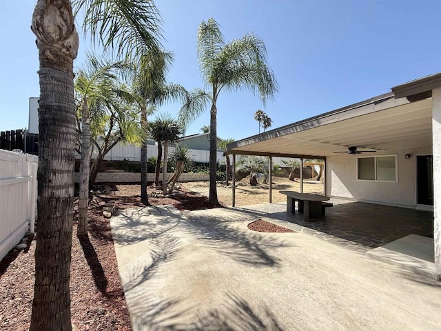 9944 Donner St, Santee, CA 92071 - fenced backyard featuring ceiling fan and a patio area