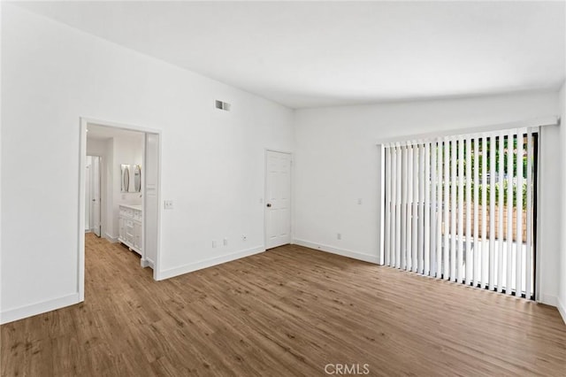 25632 Seaside Dr Unit 140, Dana Point, CA 92629 - empty room featuring wood finished floors and baseboards