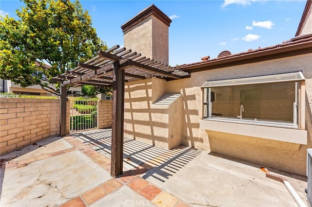 25632 Seaside Dr Unit 140, Dana Point, CA 92629 - view of patio / terrace with a gate and a pergola