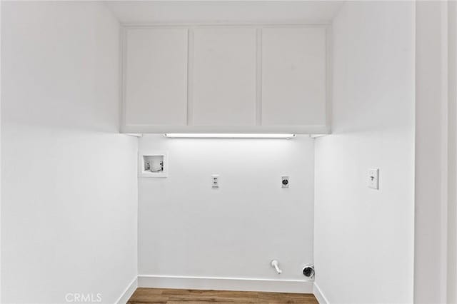 25632 Seaside Dr Unit 140, Dana Point, CA 92629 - laundry room featuring hookup for an electric dryer, hookup for a washing machine, wood finished floors, and cabinet space