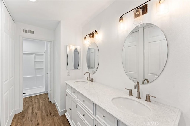 25632 Seaside Dr Unit 140, Dana Point, CA 92629 - full bath with double vanity and wood finished floors