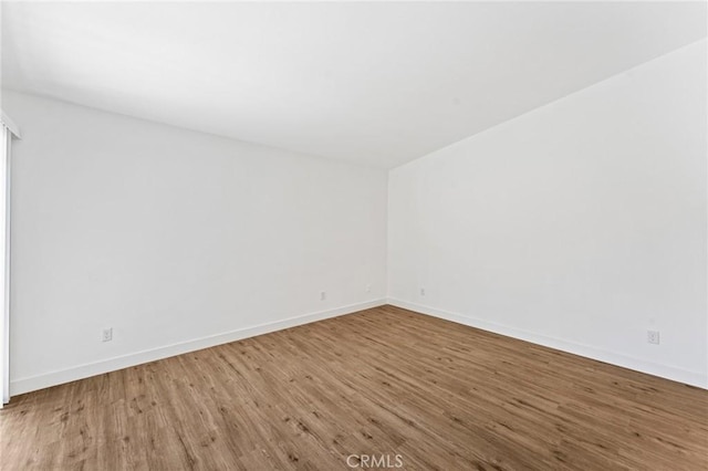25632 Seaside Dr Unit 140, Dana Point, CA 92629 - empty room with wood finished floors and baseboards