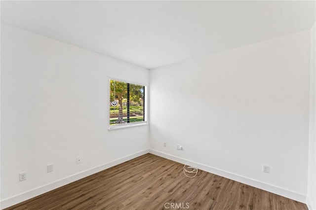 25632 Seaside Dr Unit 140, Dana Point, CA 92629 - spare room with baseboards and wood finished floors