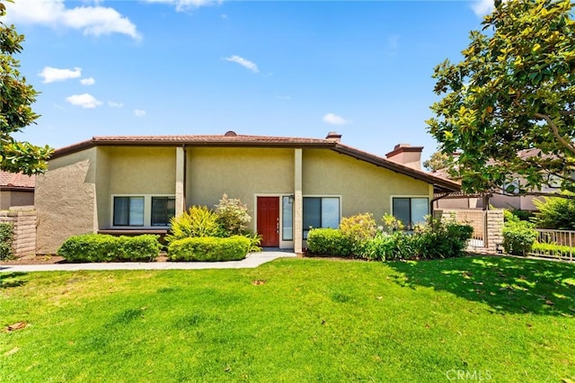 25632 Seaside Dr Unit 140, Dana Point, CA 92629 - view of front of property featuring stucco siding and a chimney