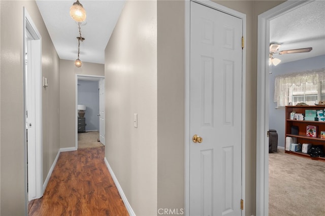 7420 London Ave, Rancho Cucamonga, CA 91730 - hall with baseboards and wood finished floors