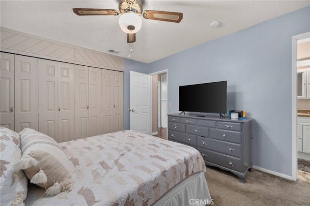 7420 London Ave, Rancho Cucamonga, CA 91730 - bedroom featuring a closet, carpet flooring, ceiling fan, ensuite bath, and a textured ceiling