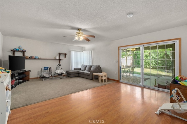 7420 London Ave, Rancho Cucamonga, CA 91730 - living area with wood finished floors, ceiling fan, healthy amount of natural light, and a textured ceiling