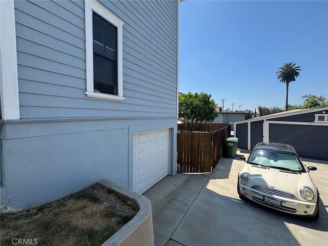 6233 Haviland Ave, Whittier, CA 90601 - view of side of property featuring an attached garage and driveway