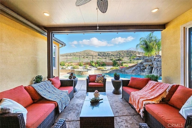 11905 Flicker Cv, Corona, CA 92883 - fenced backyard featuring an outdoor living space, a mountain view, and a patio area
