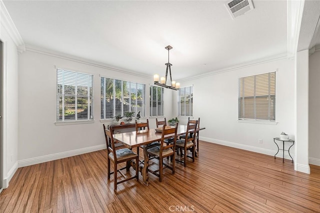 11905 Flicker Cv, Corona, CA 92883 - dining room with a chandelier, crown molding, and light wood finished floors