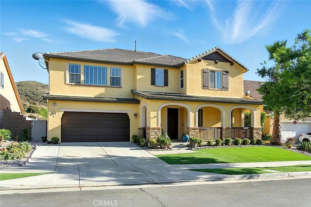 11905 Flicker Cv, Corona, CA 92883 - view of front facade with covered porch, stucco siding, a garage, and concrete driveway