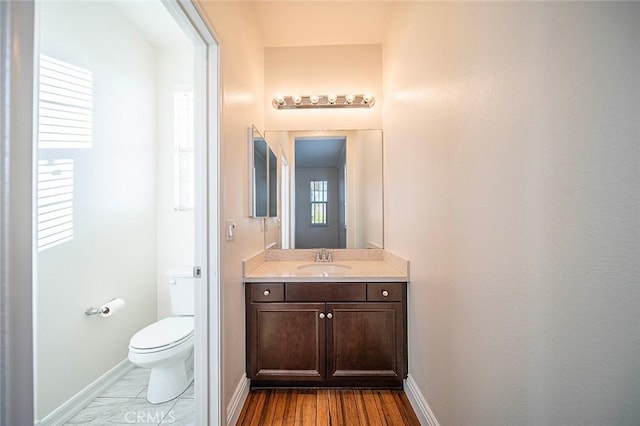 11905 Flicker Cv, Corona, CA 92883 - half bath with vanity and wood finished floors