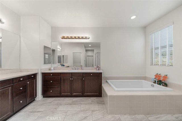 11905 Flicker Cv, Corona, CA 92883 - bathroom with a bath, vanity, and marble finish flooring