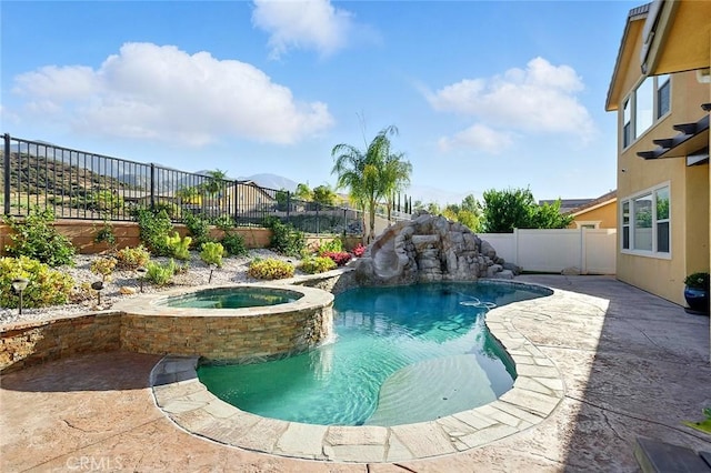 11905 Flicker Cv, Corona, CA 92883 - view of swimming pool featuring a fenced backyard, a pool with connected hot tub, and a patio