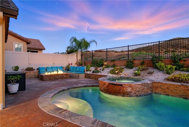 11905 Flicker Cv, Corona, CA 92883 - pool at dusk featuring a fire pit, a patio area, and a fenced backyard