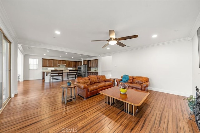 11905 Flicker Cv, Corona, CA 92883 - living room featuring wood finished floors, a ceiling fan, crown molding, and recessed lighting