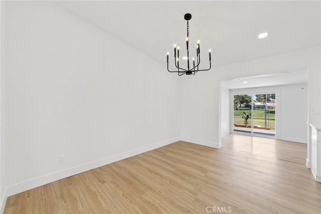 22959 Vought St, Moreno Valley, CA 92553 - empty room with a chandelier, light wood-style floors, and recessed lighting