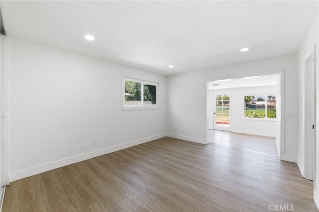 22959 Vought St, Moreno Valley, CA 92553 - spare room with healthy amount of natural light, wood finished floors, and recessed lighting
