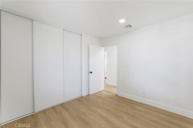 22959 Vought St, Moreno Valley, CA 92553 - unfurnished bedroom with light wood-type flooring, a closet, and recessed lighting