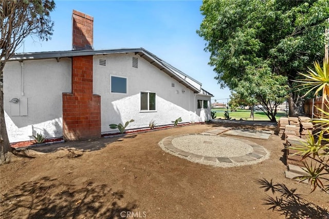 22959 Vought St, Moreno Valley, CA 92553 - back of property with a chimney and stucco siding