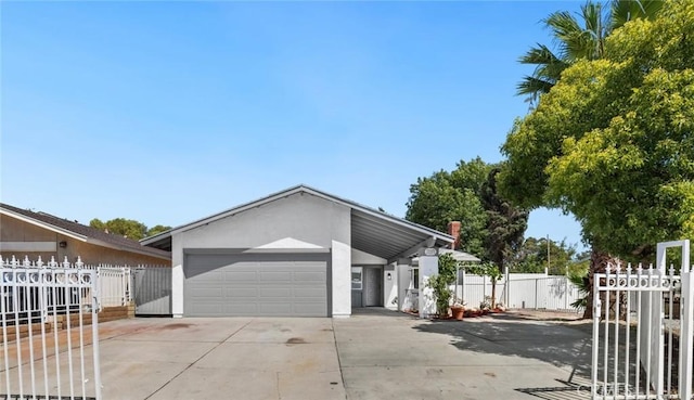 22959 Vought St, Moreno Valley, CA 92553 - view of front of home with stucco siding, a garage, and driveway
