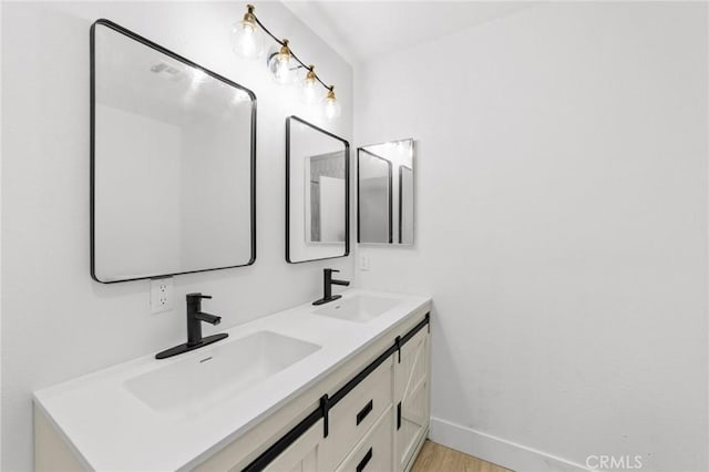 22959 Vought St, Moreno Valley, CA 92553 - bathroom featuring double vanity and wood finished floors