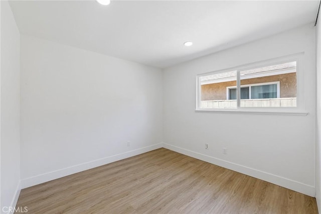 22959 Vought St, Moreno Valley, CA 92553 - empty room with wood finished floors and recessed lighting