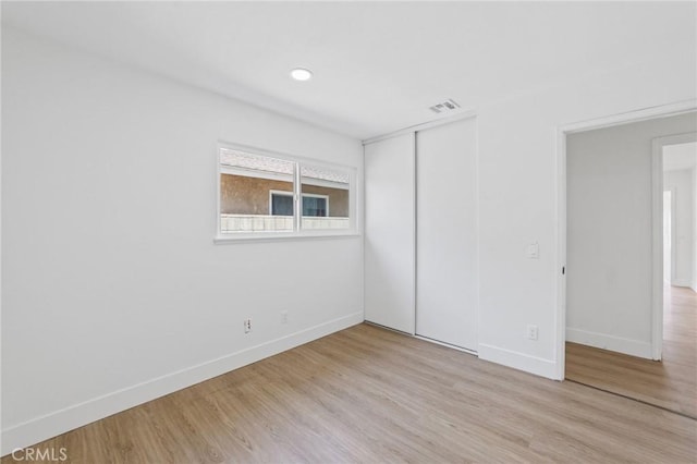 22959 Vought St, Moreno Valley, CA 92553 - unfurnished bedroom featuring wood finished floors and a closet