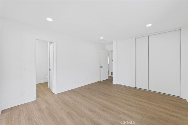 22959 Vought St, Moreno Valley, CA 92553 - unfurnished bedroom featuring light wood-style floors, recessed lighting, and a closet