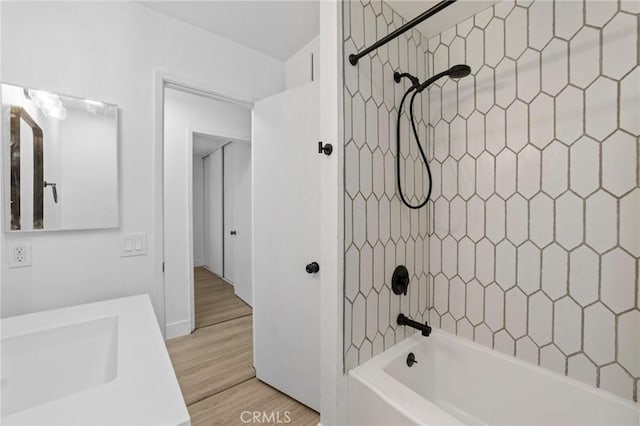 22959 Vought St, Moreno Valley, CA 92553 - full bath featuring washtub / shower combination, wood finished floors, and vanity