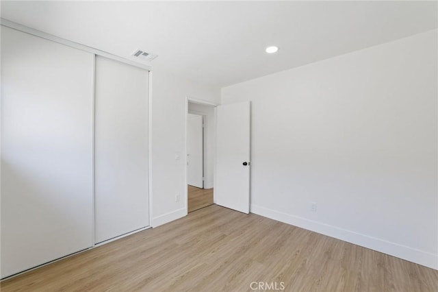 22959 Vought St, Moreno Valley, CA 92553 - unfurnished bedroom with wood finished floors, recessed lighting, and a closet