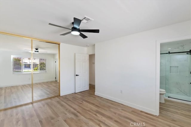 43000 Connecticut St, Palm Desert, CA 92211 - unfurnished bedroom featuring wood finished floors, a closet, connected bathroom, and a ceiling fan