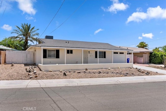 43000 Connecticut St, Palm Desert, CA 92211 - ranch-style house with an attached garage, stucco siding, concrete driveway, and covered porch