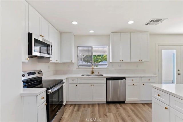 43000 Connecticut St, Palm Desert, CA 92211 - kitchen with stainless steel appliances, light countertops, white cabinets, and recessed lighting